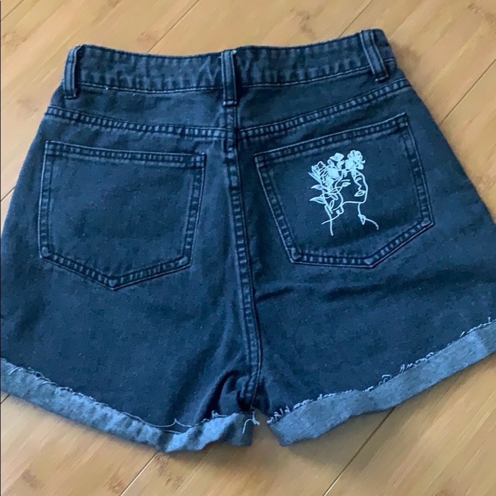 Black denim high waisted shorts with pocket detail